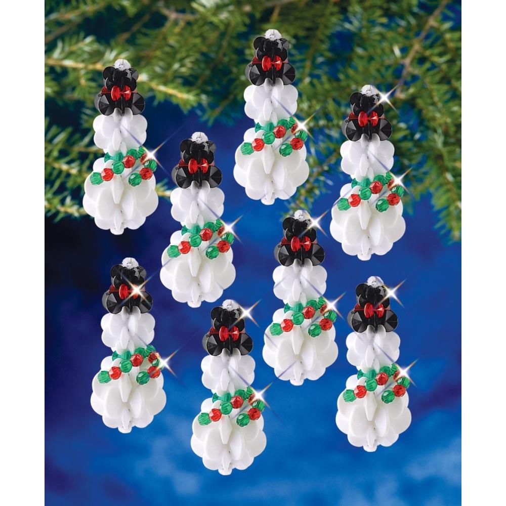 Decorative Christmas ornaments featuring black bears with red bows and green holly leaves on a blue background.