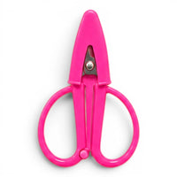 A small hot pink pair of scissors with a matching point protector on a white background