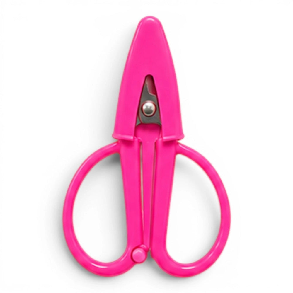 A small hot pink pair of scissors with a matching point protector on a white background