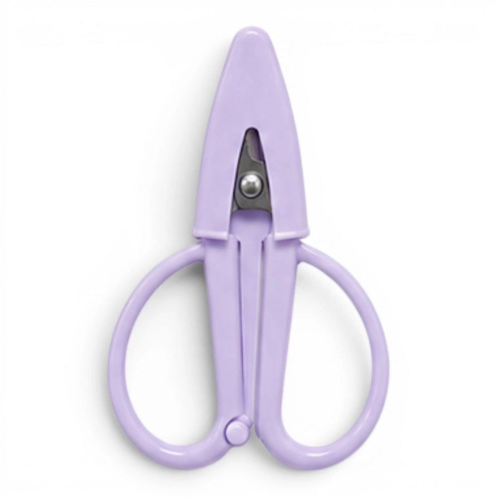 A small lavender pair of scissors with a matching point protector on a white background