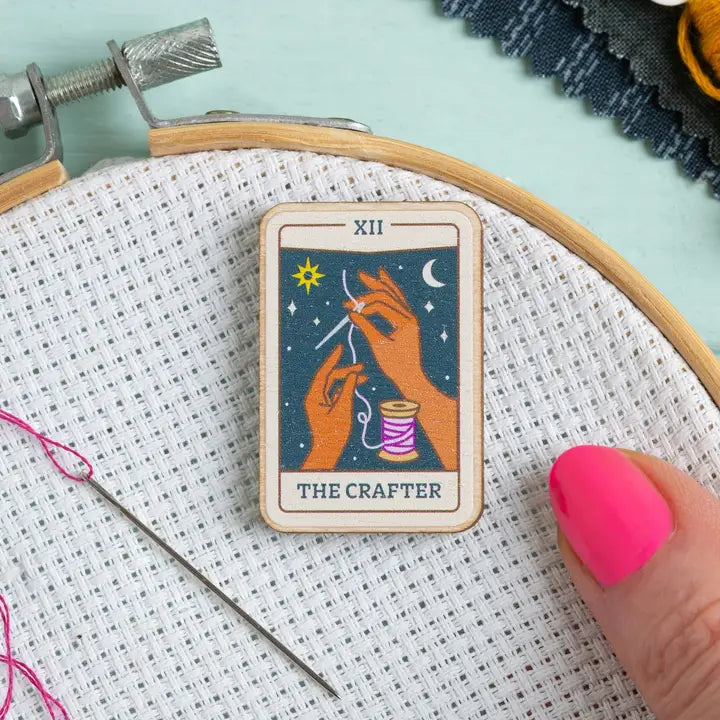 Tarot card needle minder