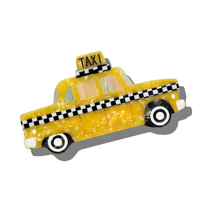Hair claw clip shaped like a yellow taxi.