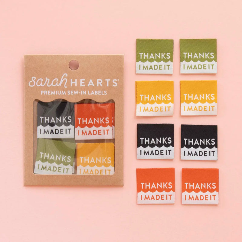Packaging of 'Thanks I Made It' labels by Sarah Hearts on a pink background