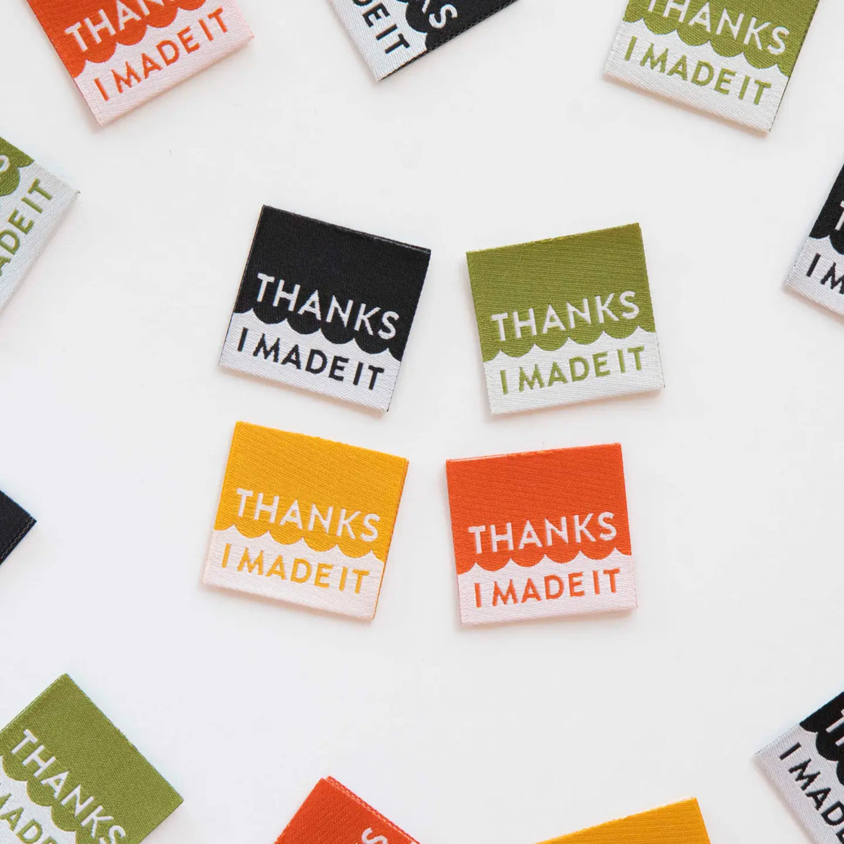 Colorful stickers with 'Thanks I Made It' text on a white background