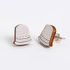 Pair of thimble earrings  on a white background