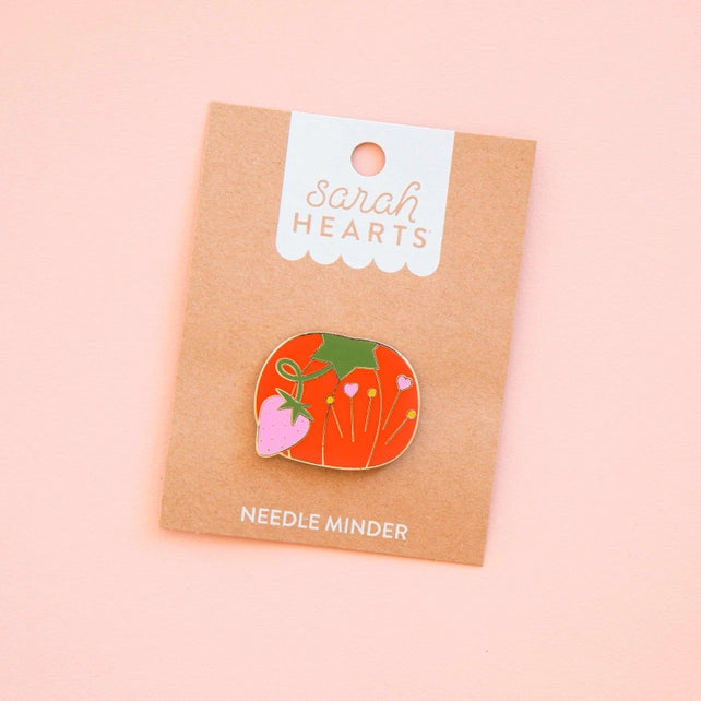 Sarah Hearts tomato needle minder on a pink background