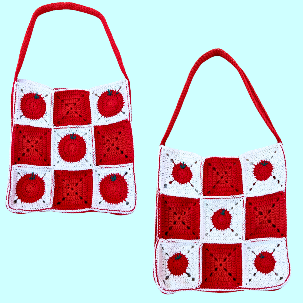 Two crocheted shoulder bags with red and white granny square panels featuring apple motifs, shown on a light blue background.