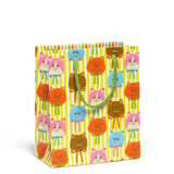 Gift bag with silly colorful cat heads wearing bows