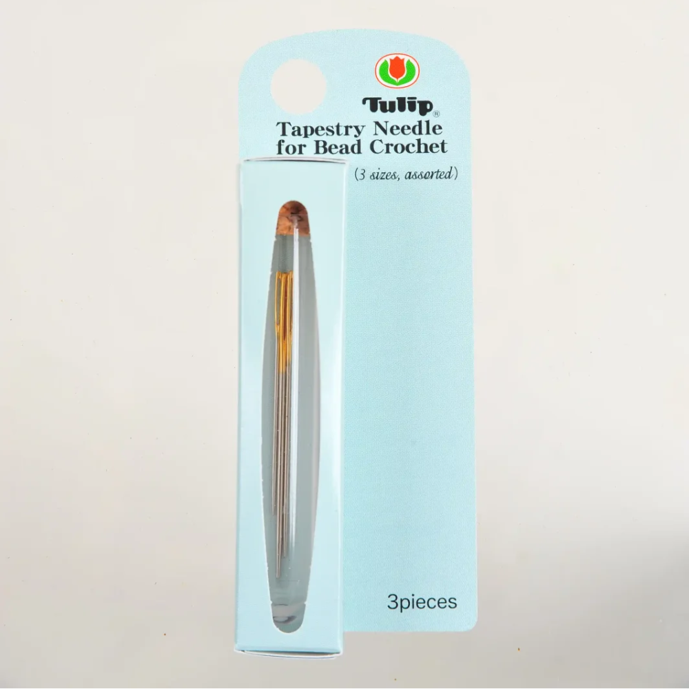Tulip brand 3-piece tapestry needle for bead crochet set in its original light blue cardboard packaging, displayed against a plain white background.