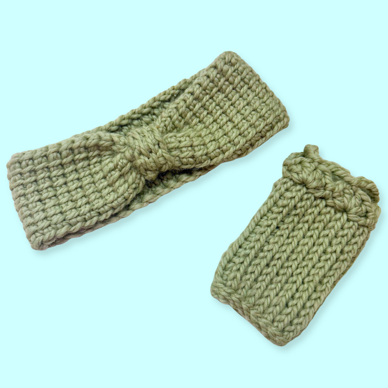 Knitted green headband and pouch on a light blue background