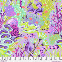 Colorful coral and sea life pattern on fabric with a ruler at the bottom.