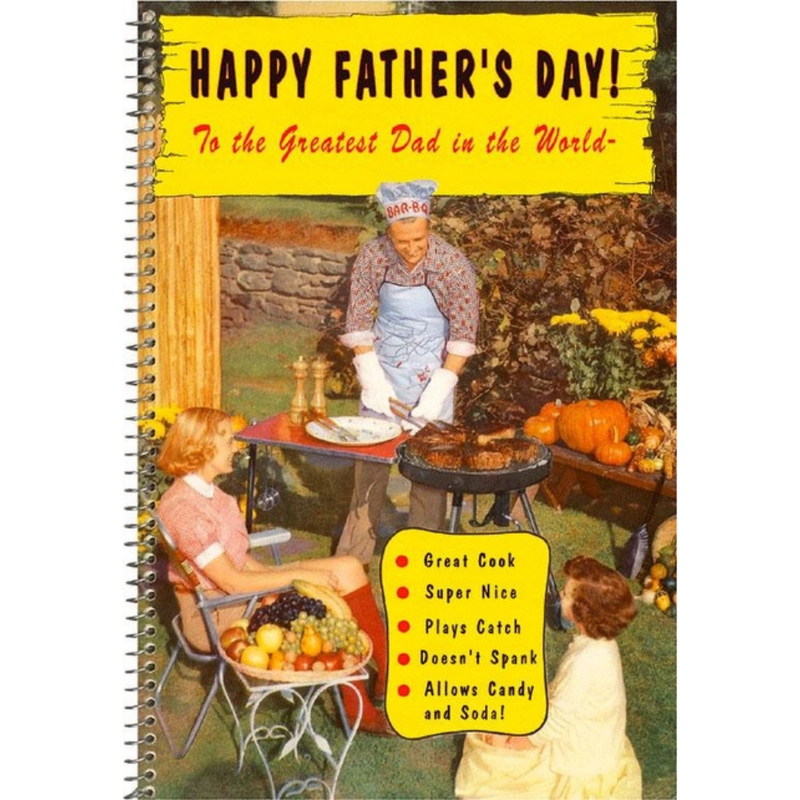 A spiral-bound Father's Day novelty card featuring a vintage-style illustration of a man grilling while two children play nearby. Large yellow text at the top reads 'HAPPY FATHER'S DAY! To the Greatest Dad in the World!' with a bulleted list of humorous features at the bottom right.