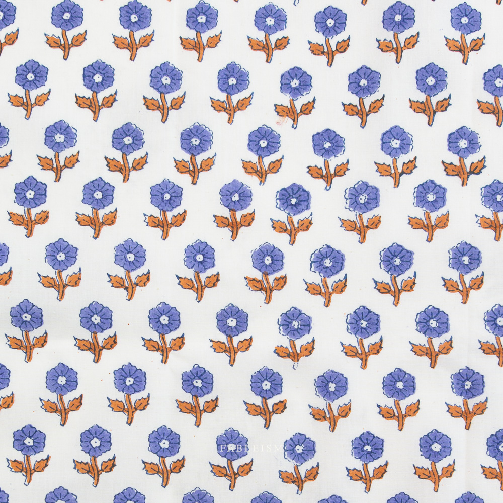 Pattern of blue purple flowers with brown stems on a white background